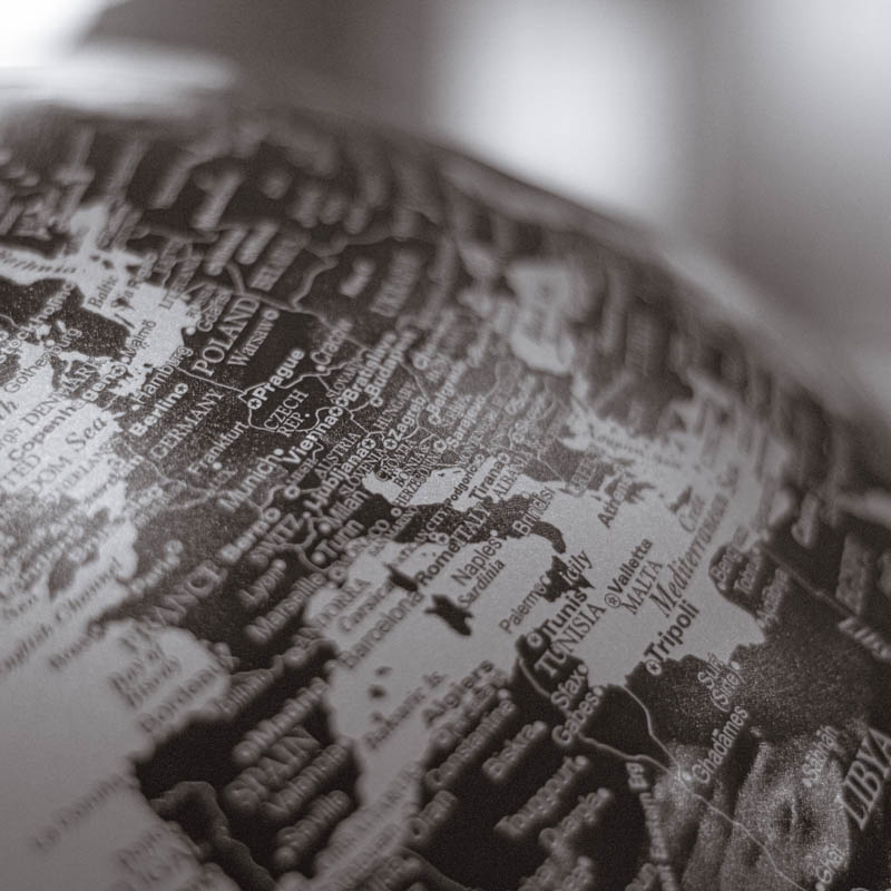 A world map on a globe, seen close up