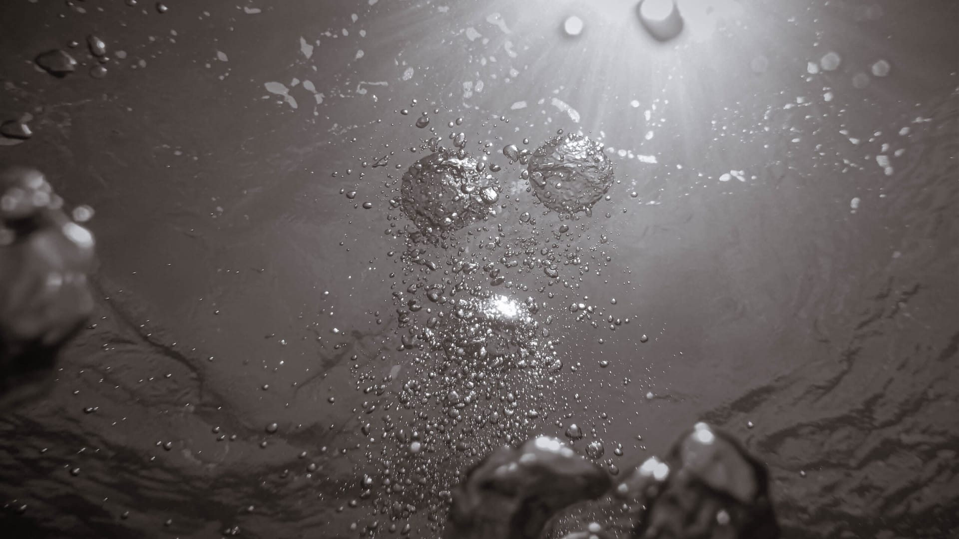 Bubbles rising through blue water