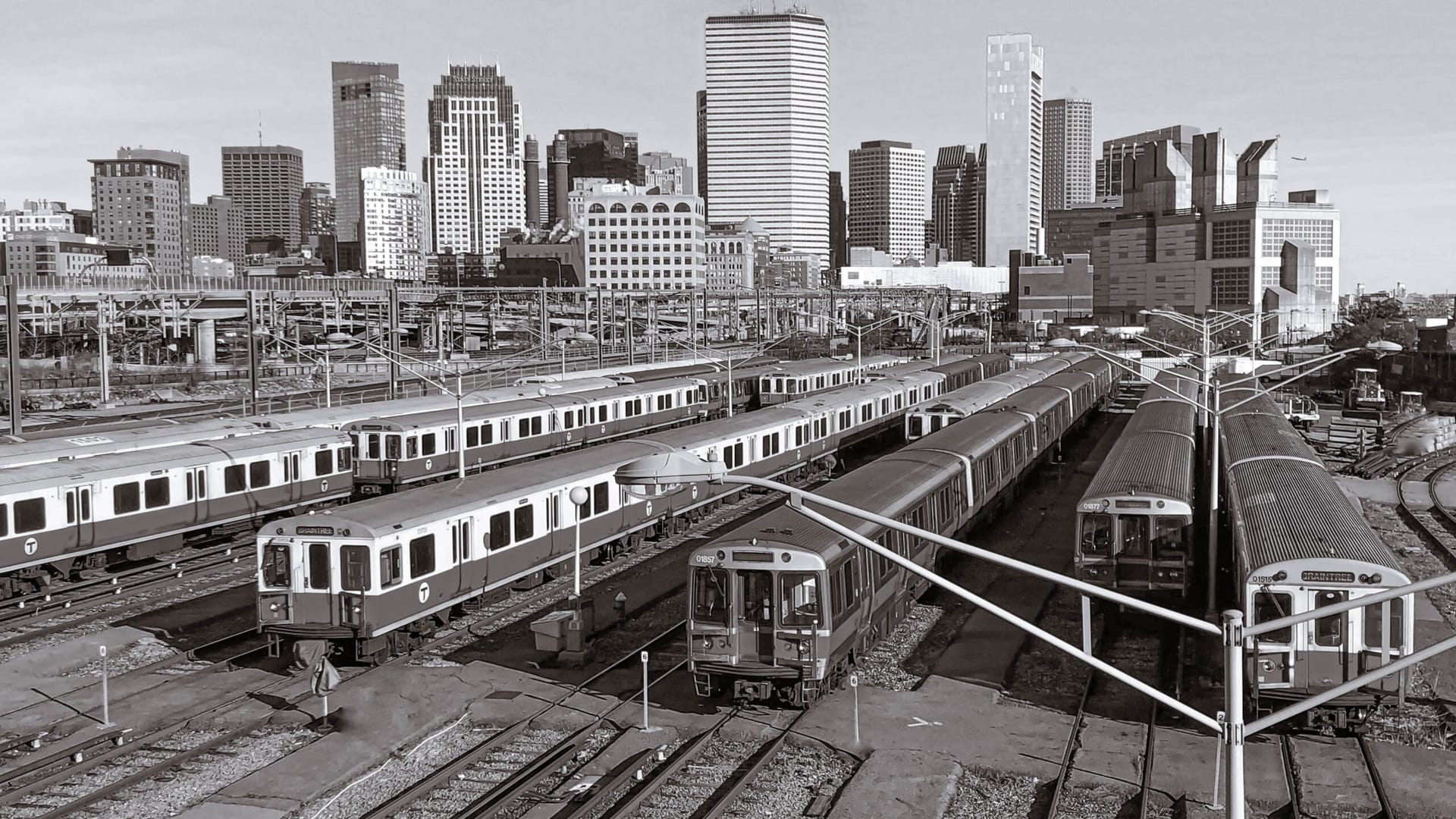 A city skyline above rail yards